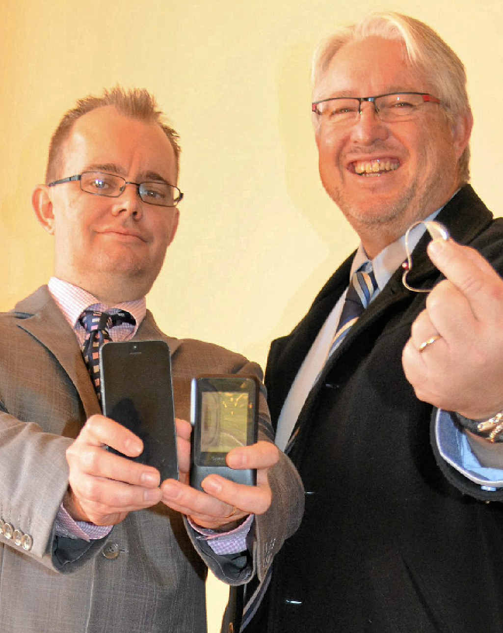 Starkey Laboratories operations manager Shane Bullivant and Mark Paton of Mark Paton and Associates Hearing Aid Specialists show off the new technology designed to give freedom back to those with hearing impairments.